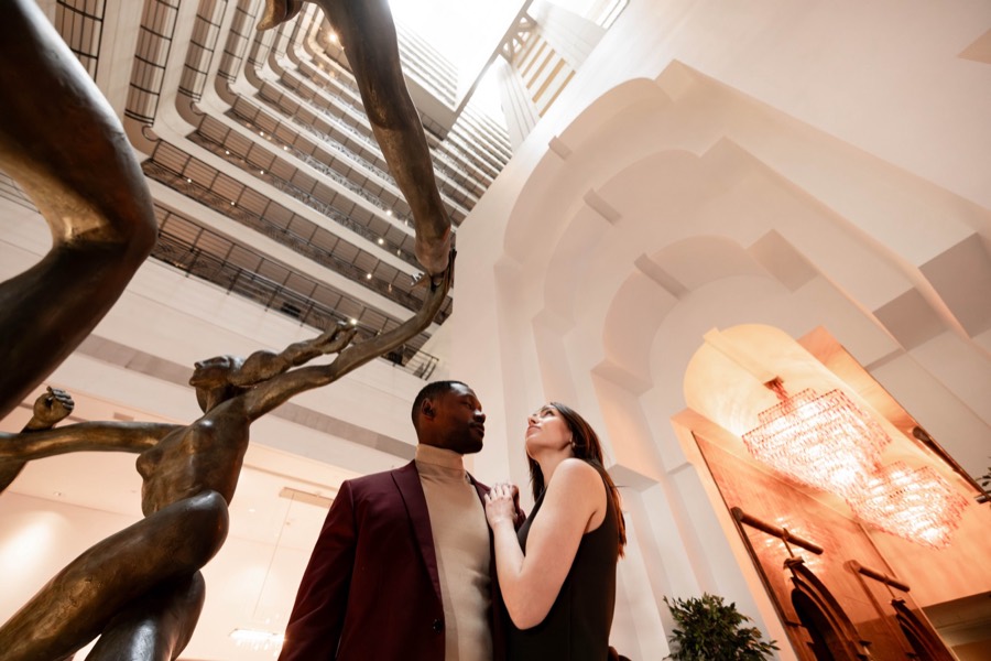 Couple beneath the atrium sculpture at JW Marriott San Francisco Union Square
