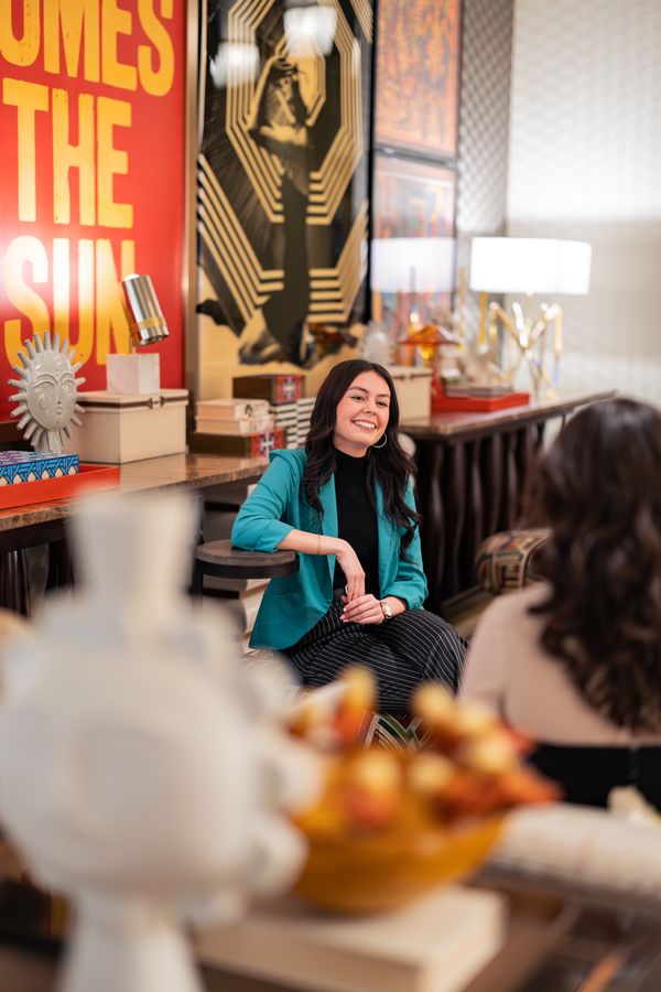 Guest smiling in the art-filled lobby lounge at Renaissance Phoenix Downtown Hotel
